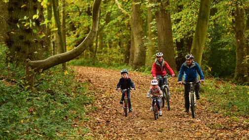 A family cycling through the estate at Blickling, Norfolk